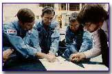 Crew discussing flight procedures